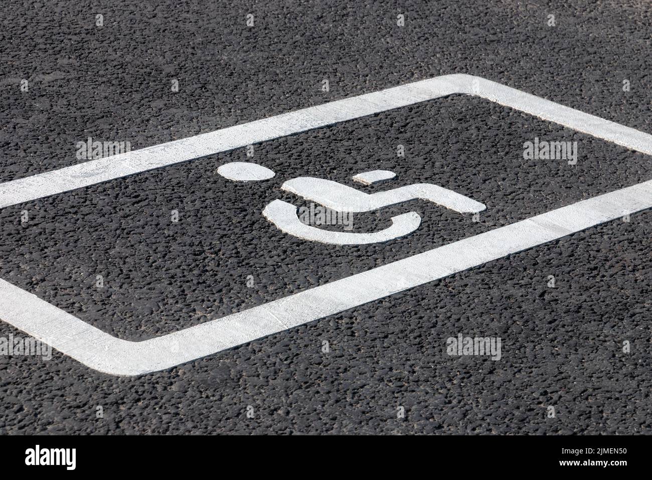 Parking spot for disabled drivers, road marking on asphalt road Stock