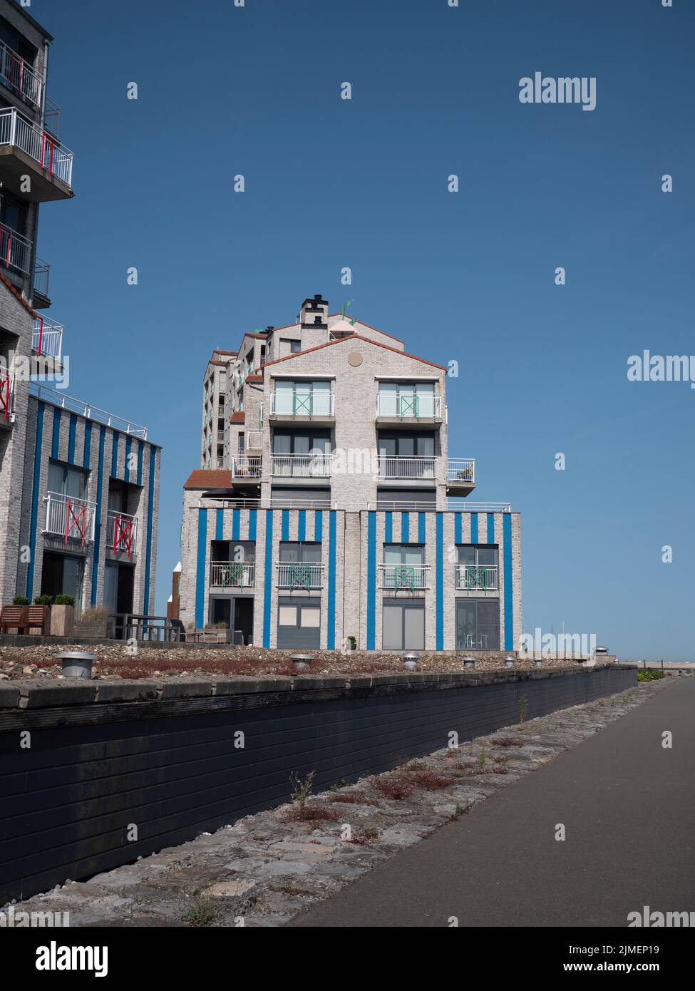 Breskens, Netherlands, July 18, 2022, Apartment building on the quay of the marina in Breskens, Port Scaldis Stock Photo