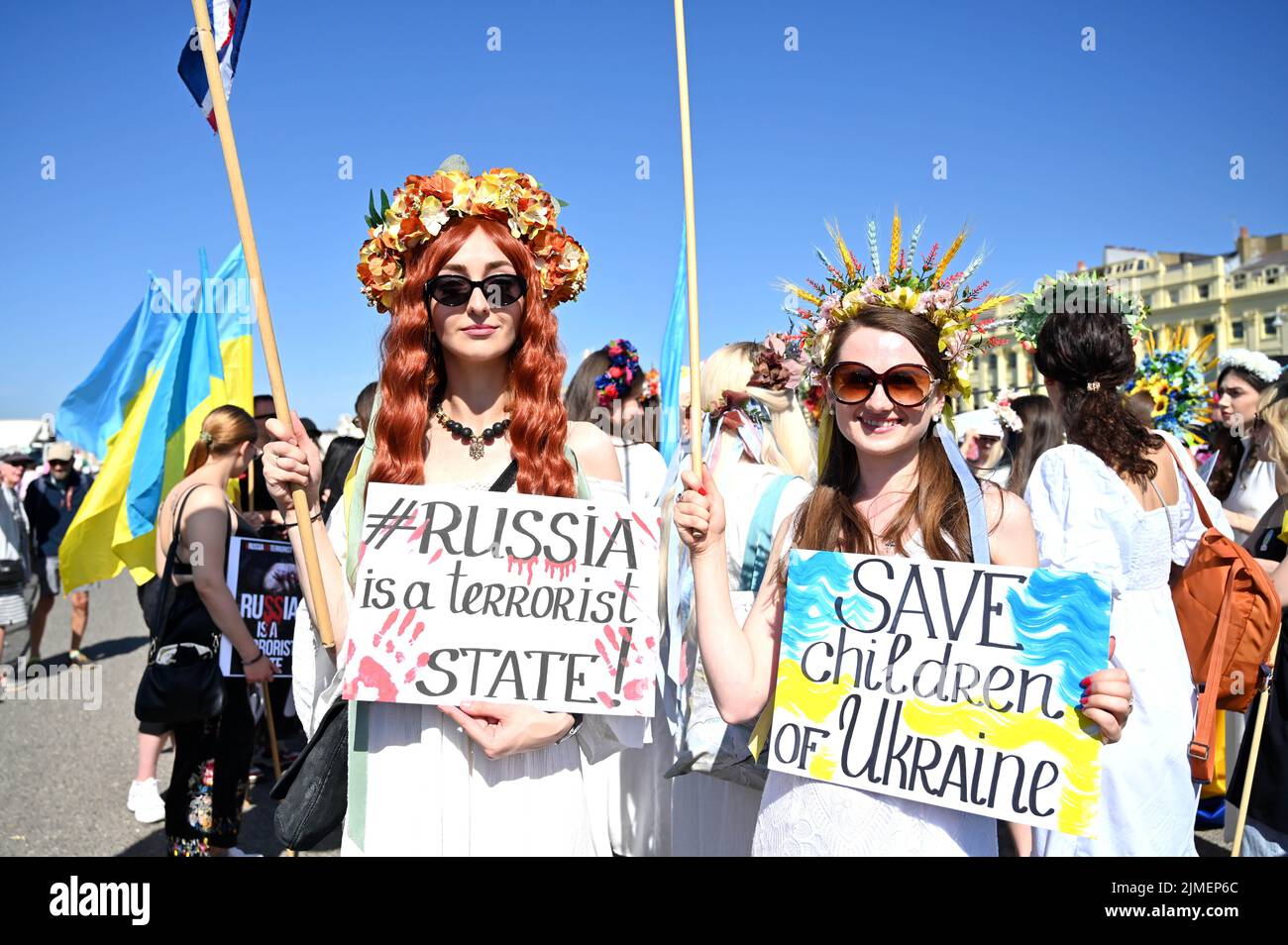 Brighton UK 6th August 2022 - Pro Ukraine supporters ready for Brighton and Hove Pride Parade on a beautiful hot sunny day. With good weather forecast large crowds are expected to attend the UK's biggest LGBTQ Pride festival in Brighton over the weekend : Credit Simon Dack / Alamy Live News Stock Photo