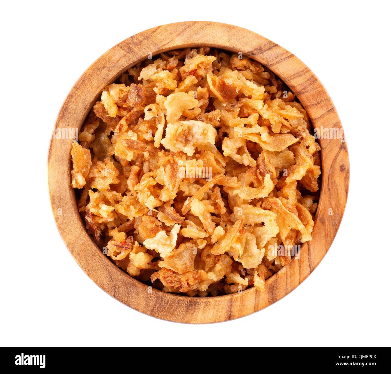 Roasted onions in wooden bowl, isolated on white background. Crispy