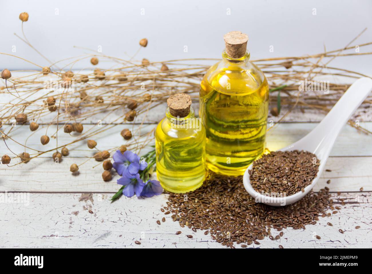 Bottles of linseed oil flowers and seeds Stock Photo Alamy