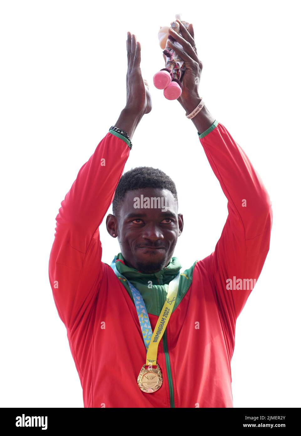 Grenada's Lindon Victor poses with his gold medal after winning the Men