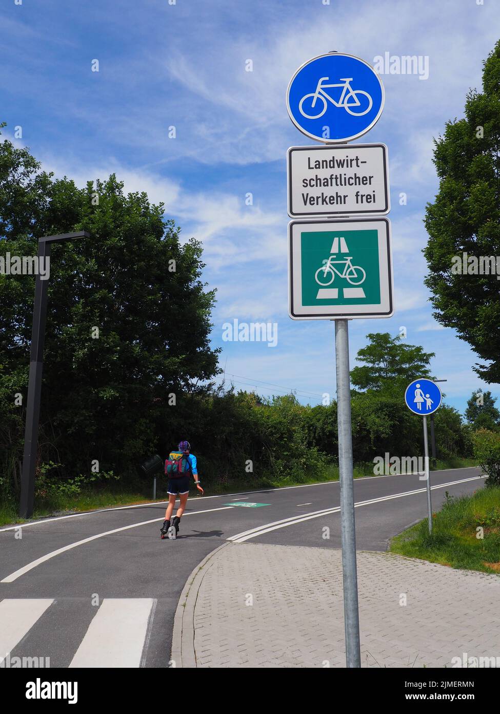 A vertical view of a female skater on the Darmstadt-Frankfurt cycle ...