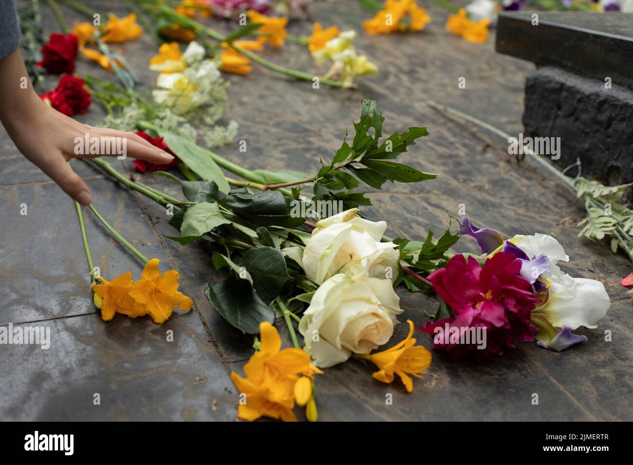 Flowers on grave. Details of ceremony. Remembrance of fallen soldier