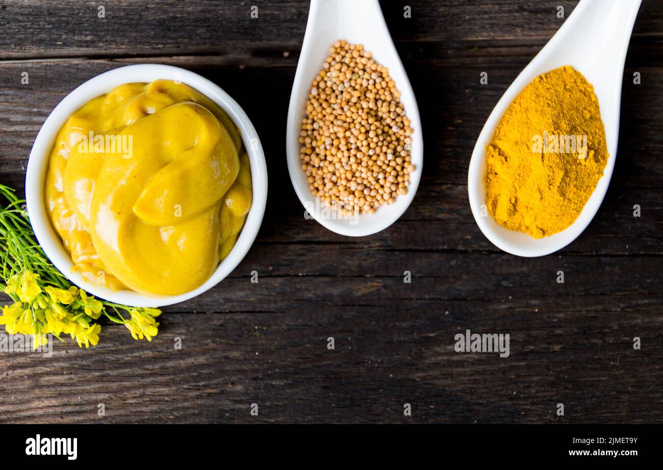 Mustard sauce and flowers and their ingredients Stock Photo Alamy