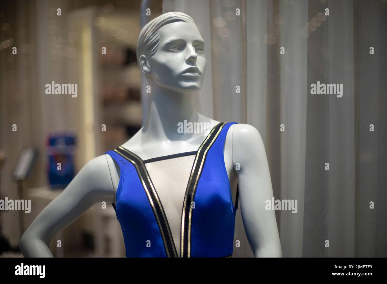 Women's mannequin in clothing store. Plastic figure of woman. Store details. Demonstration of clothes. Style and fashion on mannequin. Stock Photo