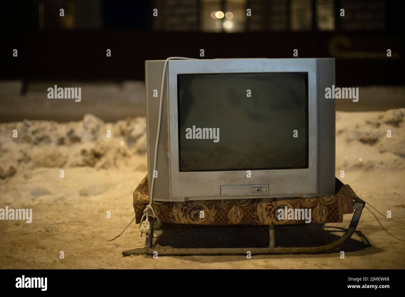 Old TV outside. TV is off. Electronics of 90s. Transportation of old thing. Stock Photo