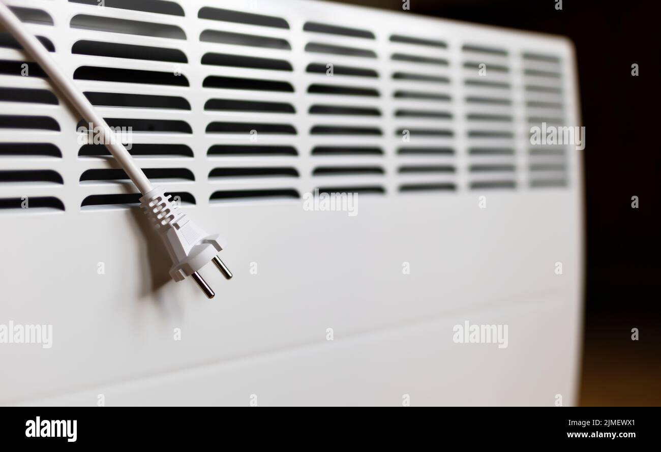Electrical plug with wire on a heater. Saving electricity, save power