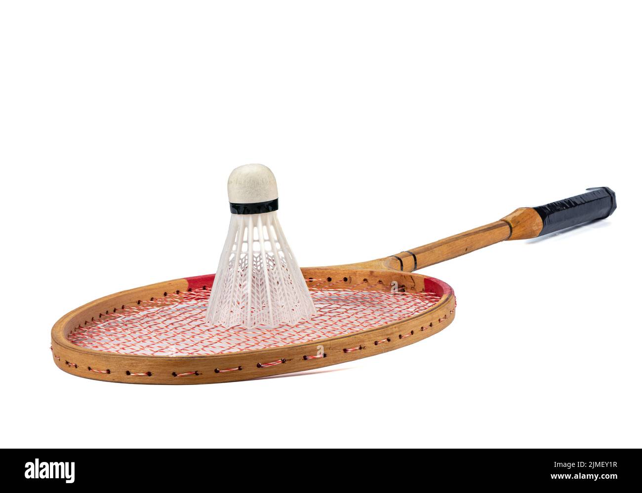 Wooden racket and plastic shuttlecock for playing badminton on a white background. Outdoor games