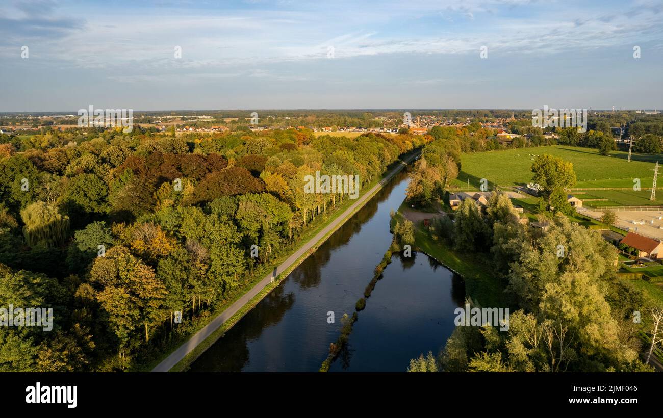 Aerial view the river on green forest plain. Amazing aerial shot of beautiful blue river. Forest background. Stock Photo