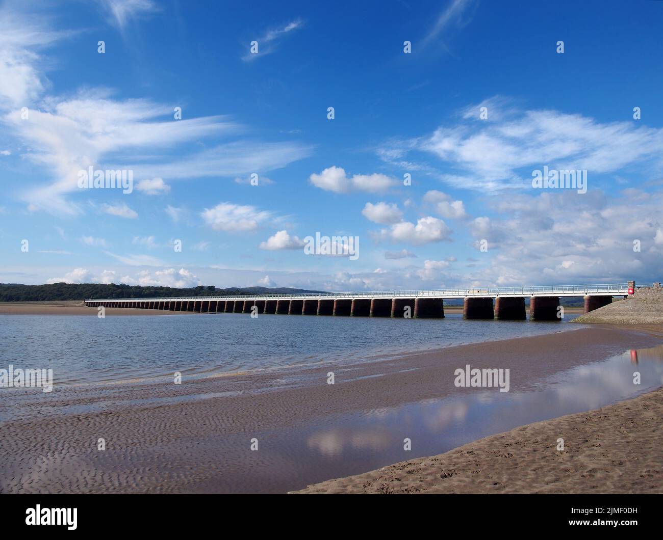 View of the beach at arnside with the leven railway viaduct and river in the south lakes area of cumbria Stock Photo