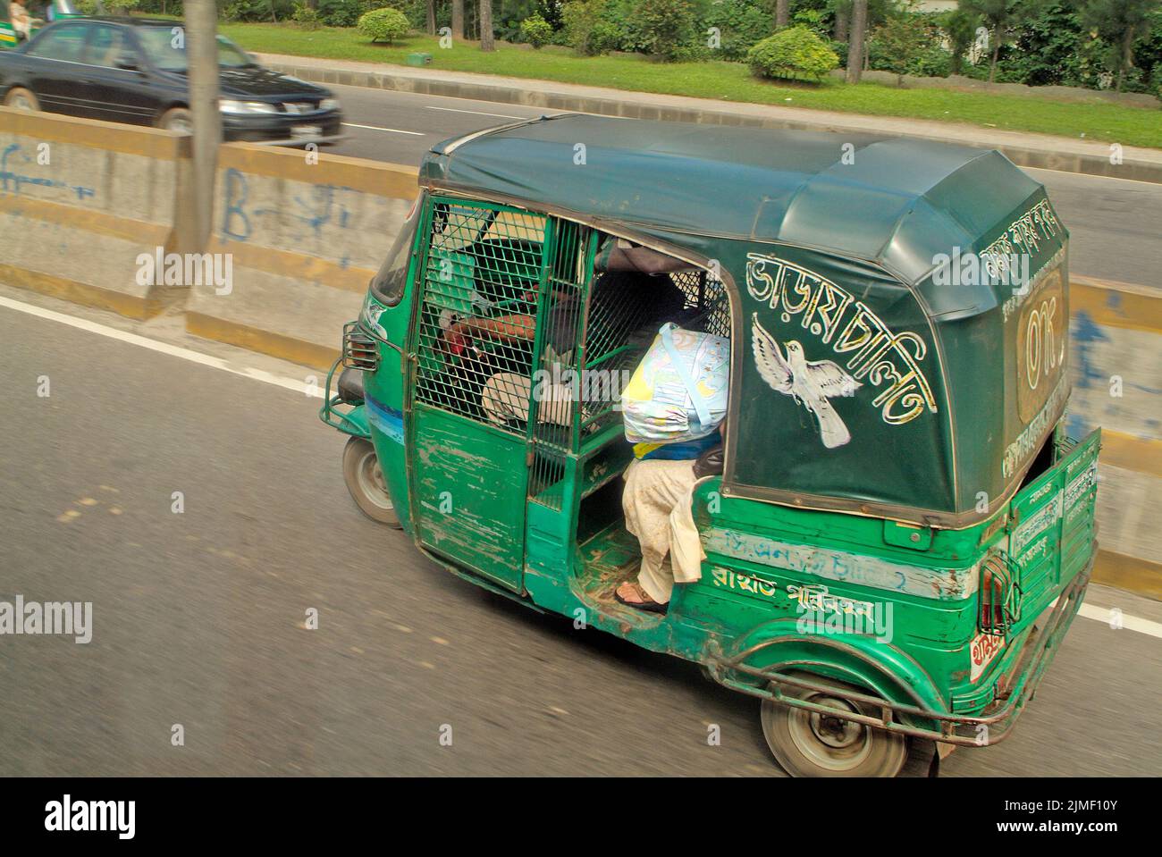 Dhaka, Bangladesh - September 17th 2007: Motorized rickshaw named Tuk-Tuk, usual mode of transport in the capital Stock Photo