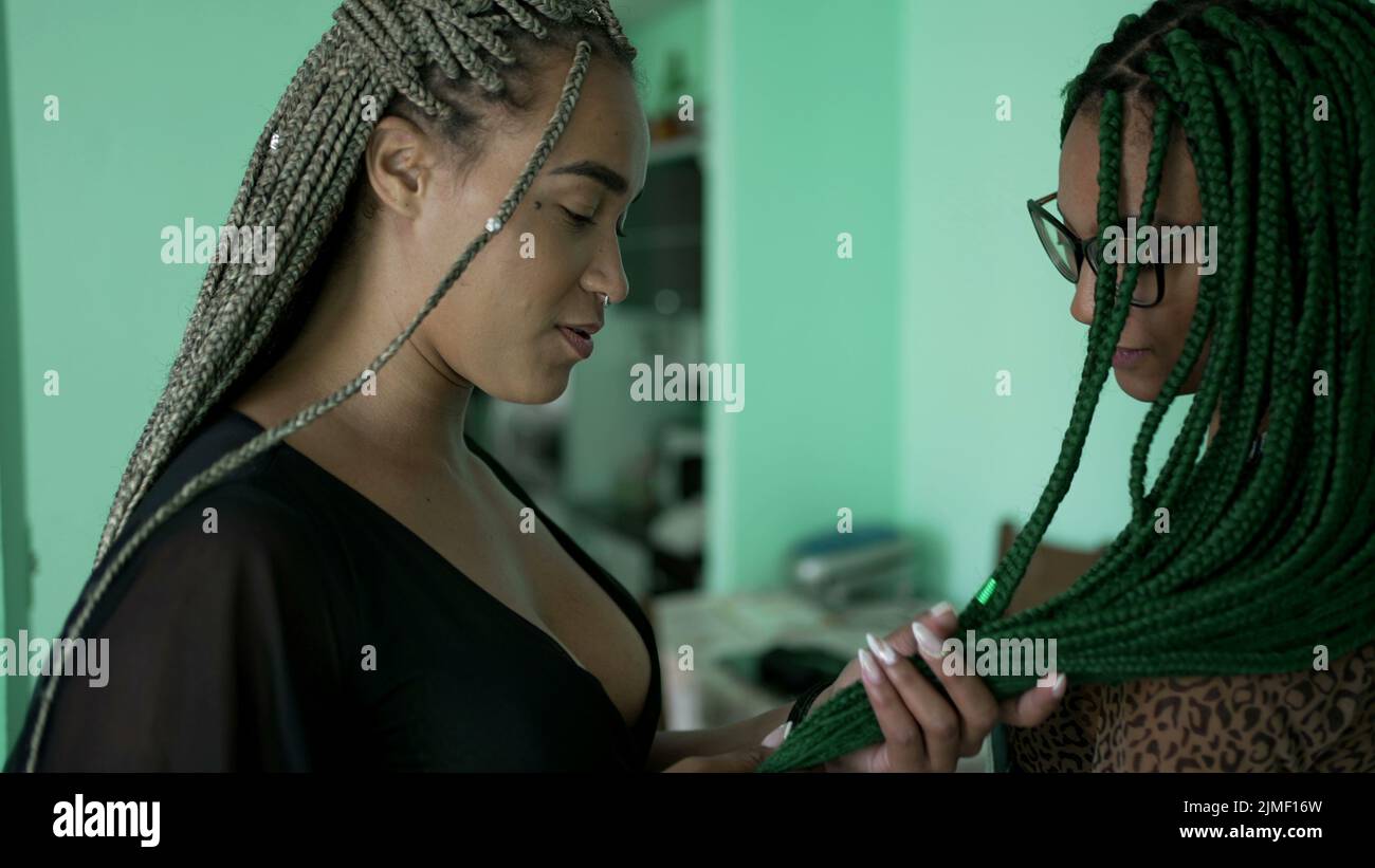 Women with box braid hairstyle. Two African American girls with braided ...