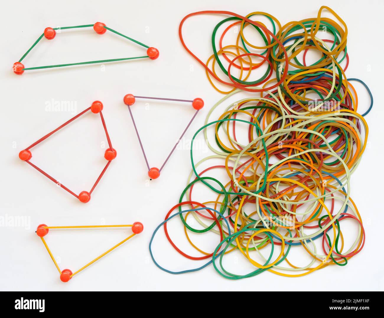 Business metaphor,networking,innovation,idea,consulting, human resources concept with drawing pins and rubber bands, some forming network structures b Stock Photo