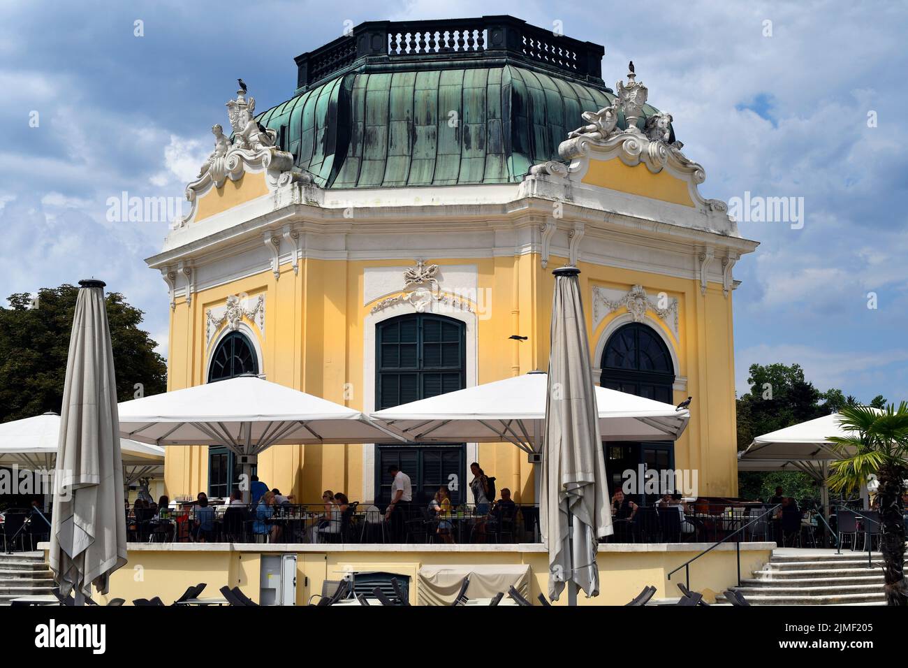 Vienna, Austria - August 01, 2022: Unidentified tourists and the so-called imperial pavilion in the zoo, now used as a cafe-restaurant- former summer Stock Photo