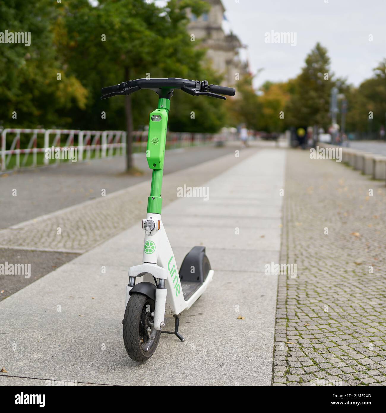 Parked e-scooter of the Lime group in the city center of Berlin Stock Photo