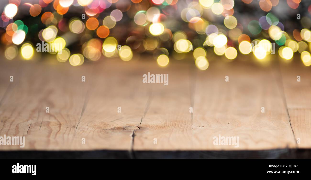 Empty wooden table top with blurred light gold bokeh abstract background. For montage product display or design key visual layou Stock Photo
