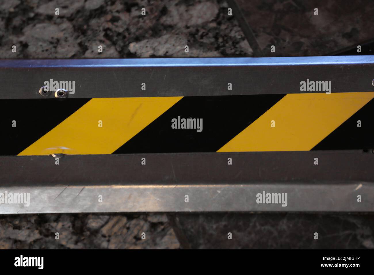 metal background with black and yellow warning stripes Stock Photo - Alamy