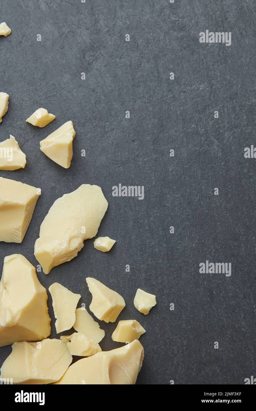 Cocoa butter chunks as background Stock Photo Alamy