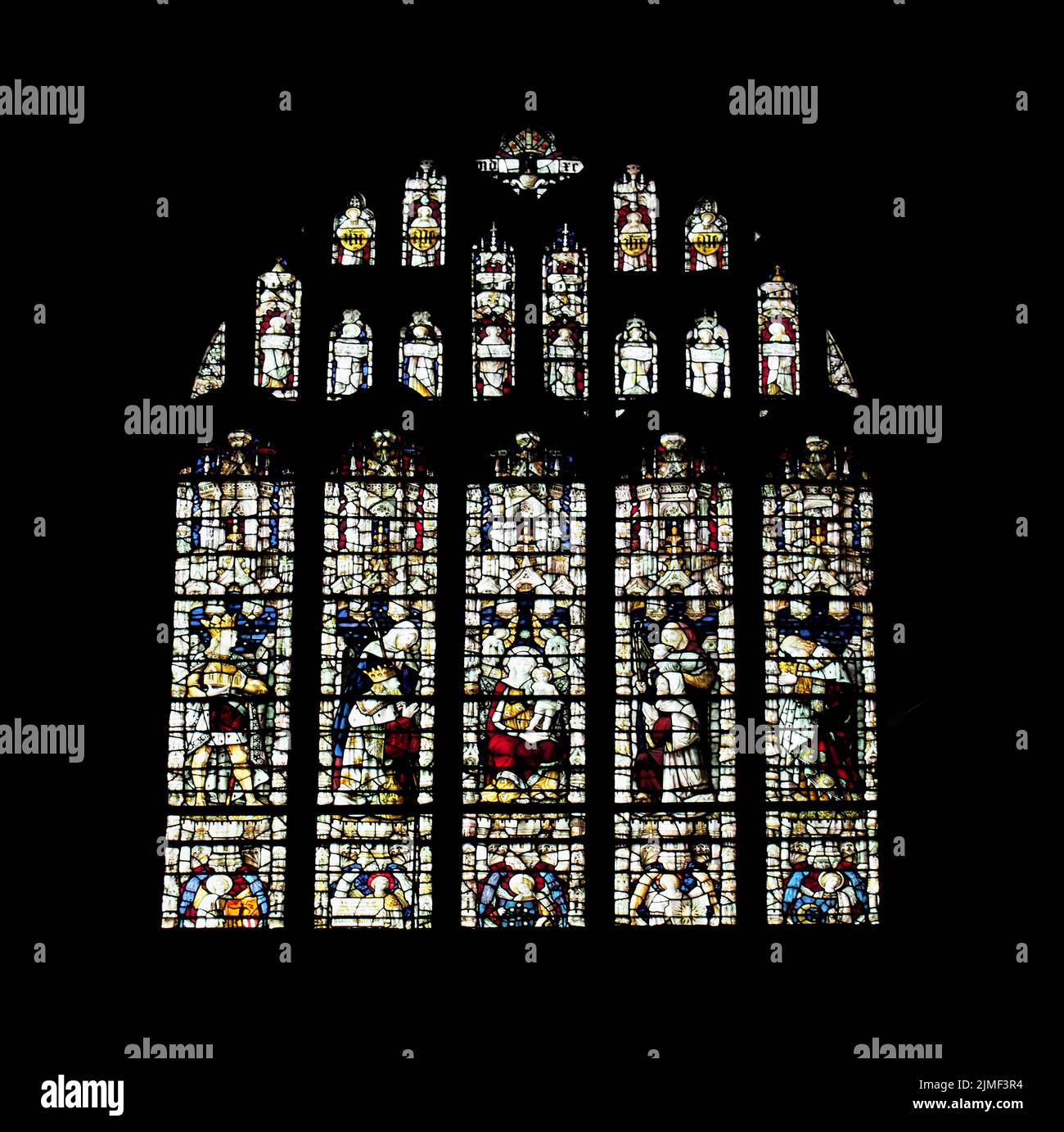 19th century stained glass window dedicated to saints in the medieval cartmel priory in cumbria Stock Photo