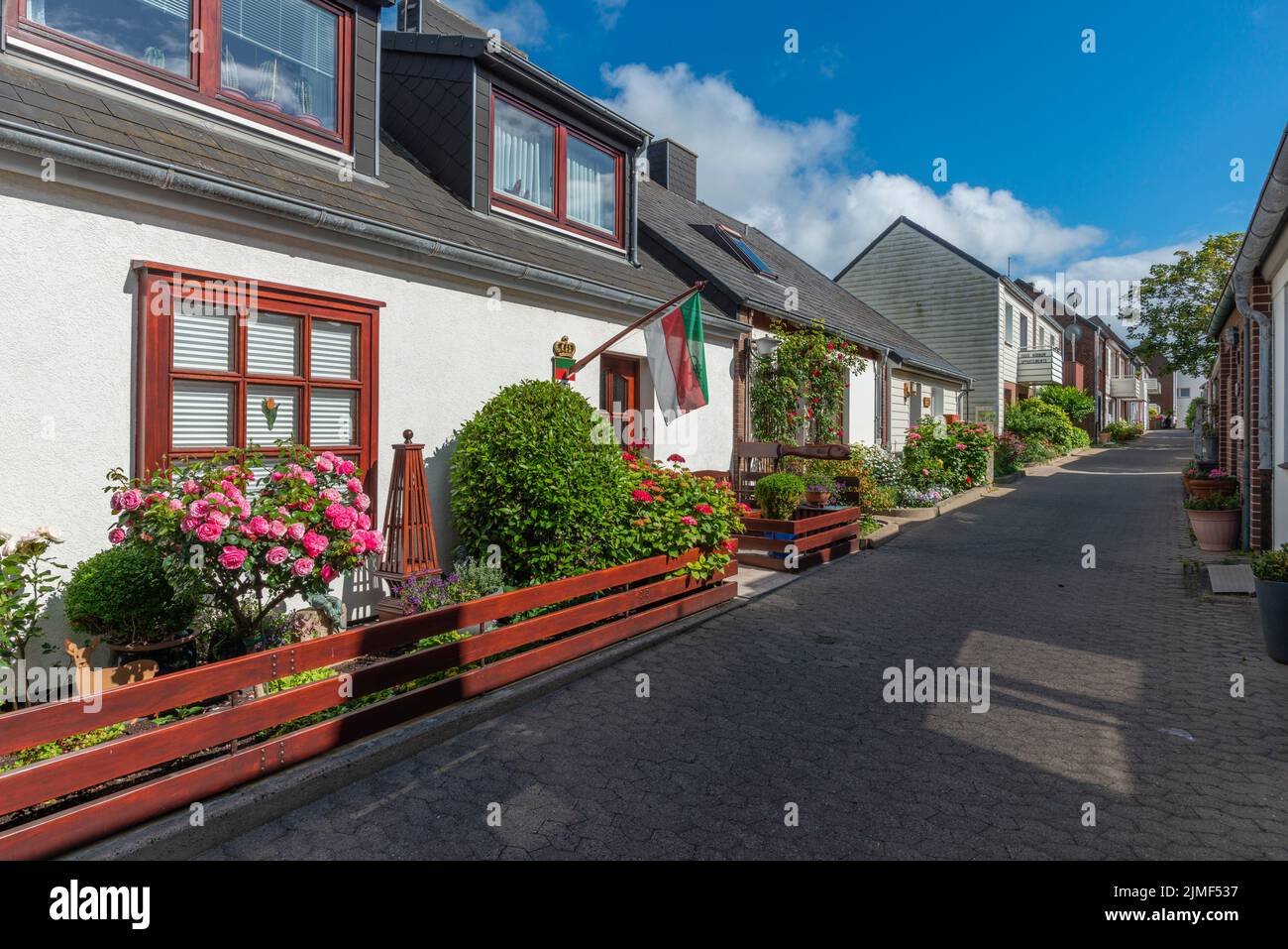 Typical architecture with earthen colors andasymmetric gables in Upper Land of North Sea island Heligoland, Schleswig-Holstein, Northern Germany Stock Photo