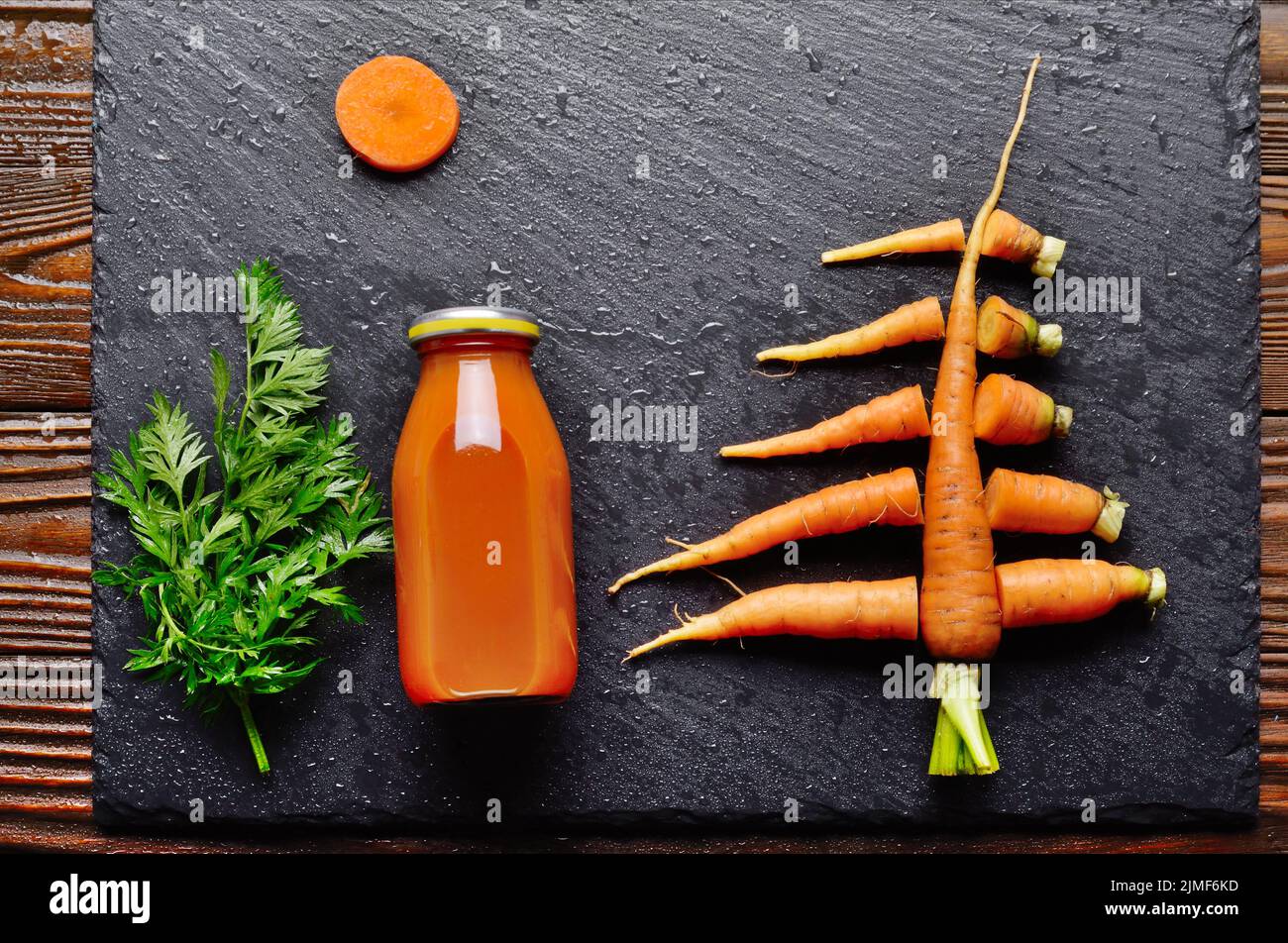 Top view at stylised christmas tree made of carrots on slate stone tray Stock Photo