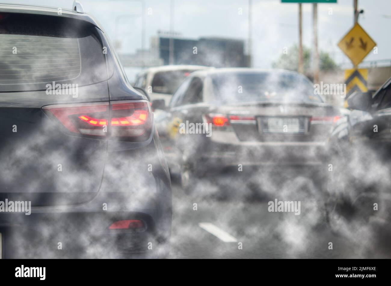 Car exhaust fumes during traffic jams on the road cause environmental