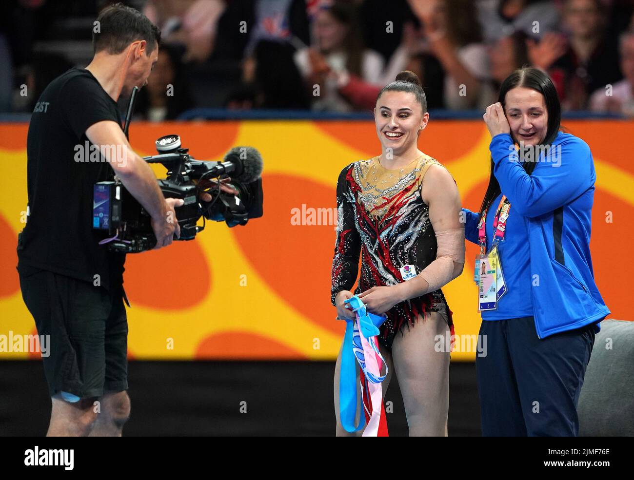 Scotland's Louise Christie (centre) after winning silver in the Rhythmic Gymnastics Ribbon Final at Arena Birmingham on day nine of the 2022 Commonwealth Games in Birmingham. Picture date: Saturday August 6, 2022. Stock Photo