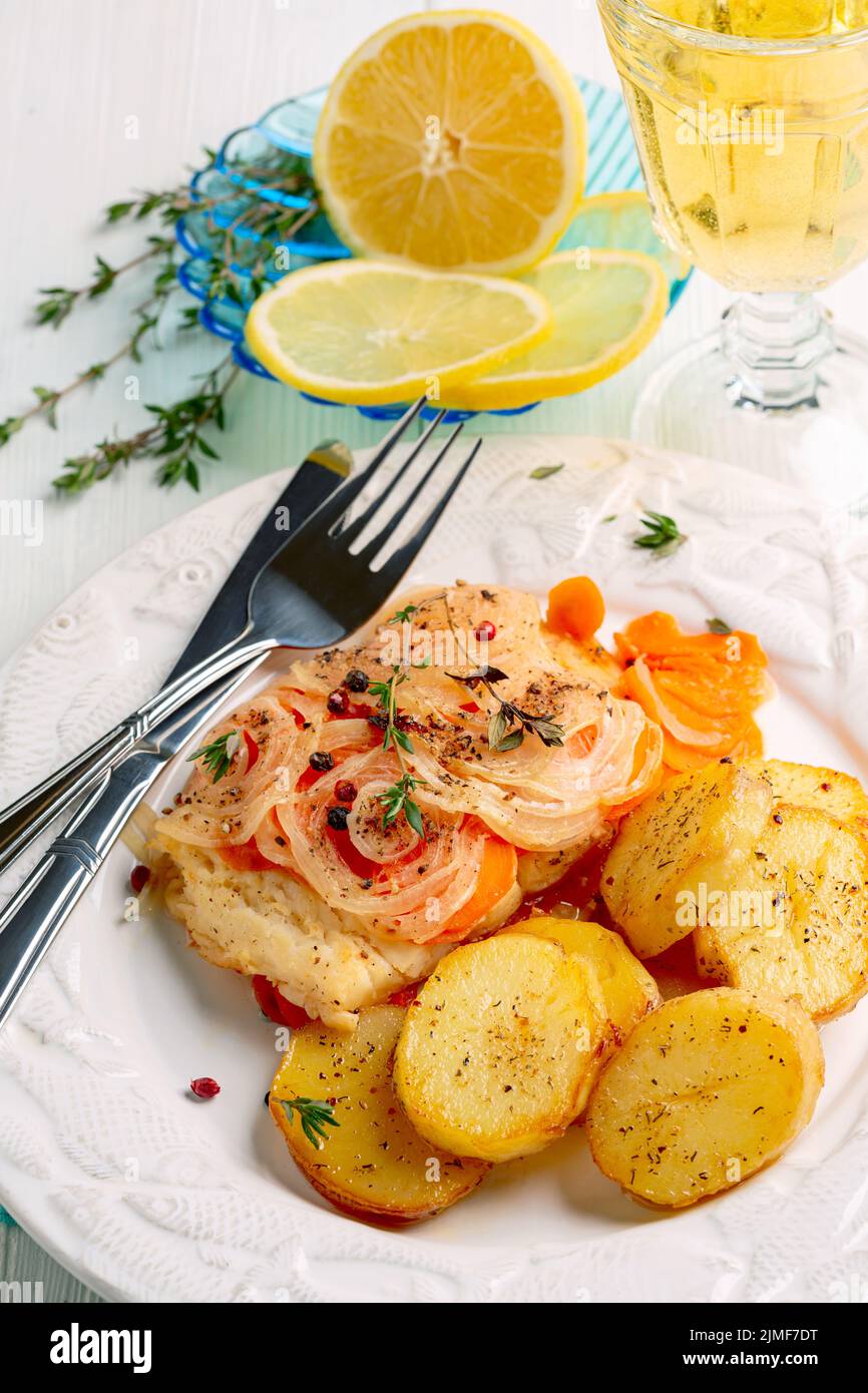 White sea fish baked with vegetables. Stock Photo