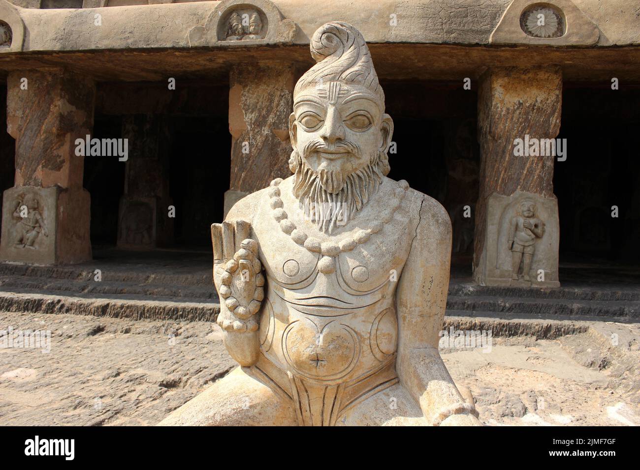 Ancient sculpture of sage in meditation at caves Stock Photo Alamy