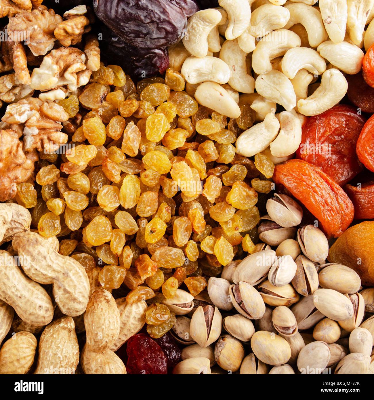 Flat lay view at assorted dried fruits and nuts. Healthy vegetarian