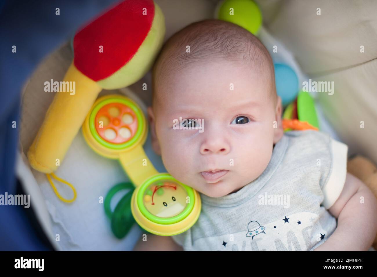 Funny baby boy is talking and using the toy telephone headset in ...