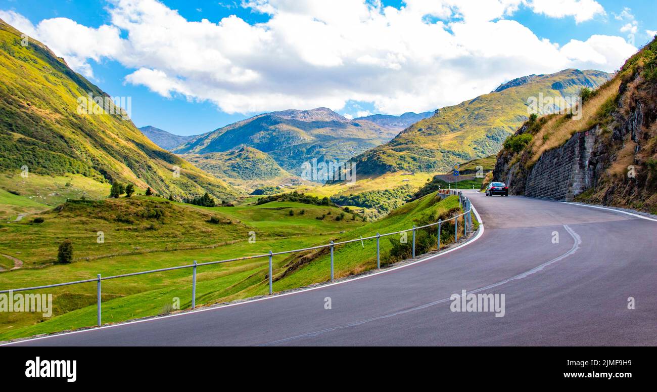 The steep and winding Furka Pass leads across valleys in the Alps connecting Central Switzerland with the Valais and the Bernese Oberland - Europe Stock Photo