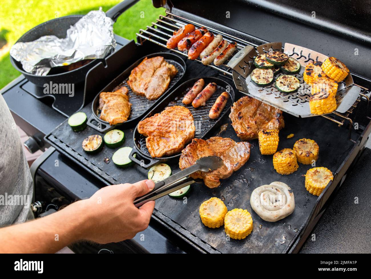 grill barbecue outdoors on the backyard. Bbq party. Stock Photo