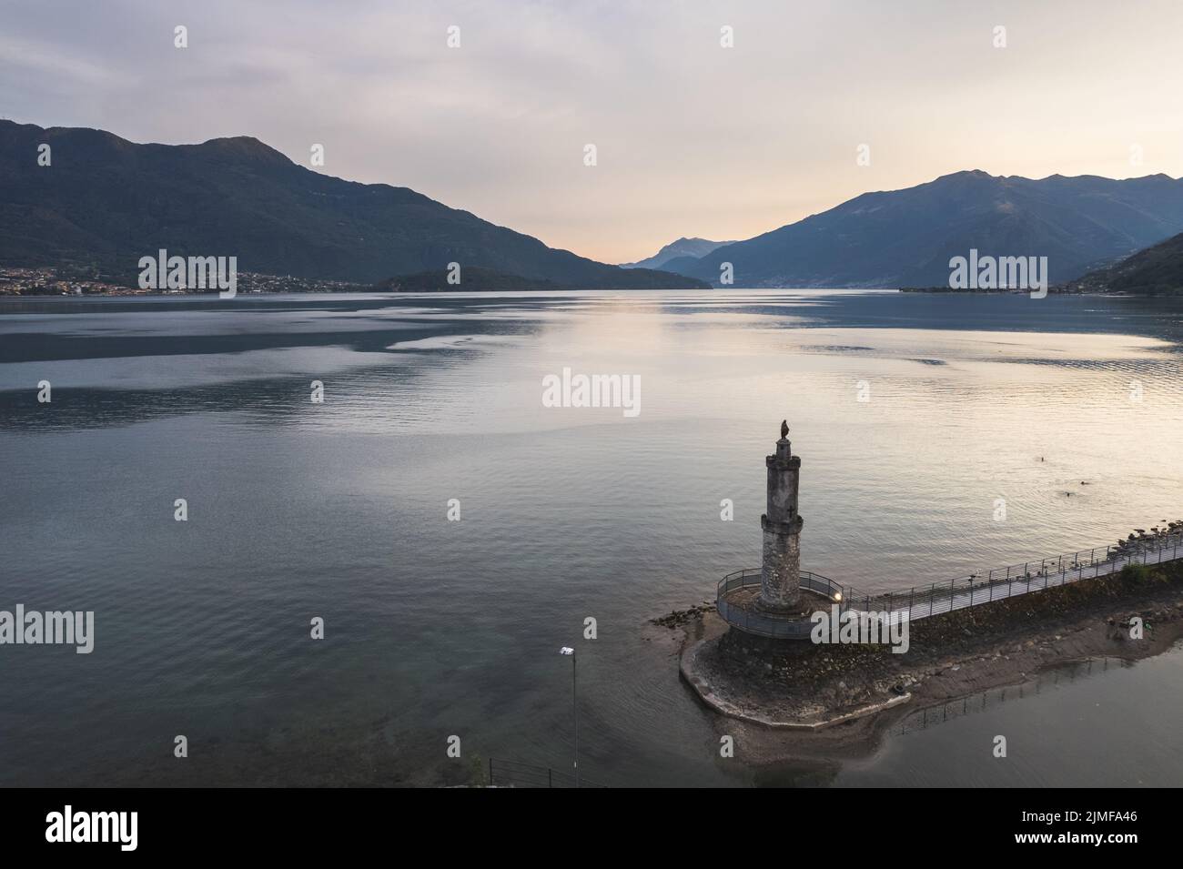 Aerial view of Lake of Como in Port of Gera Lario. Harbor entrance with Madonna on top of the tower. Italy Stock Photo