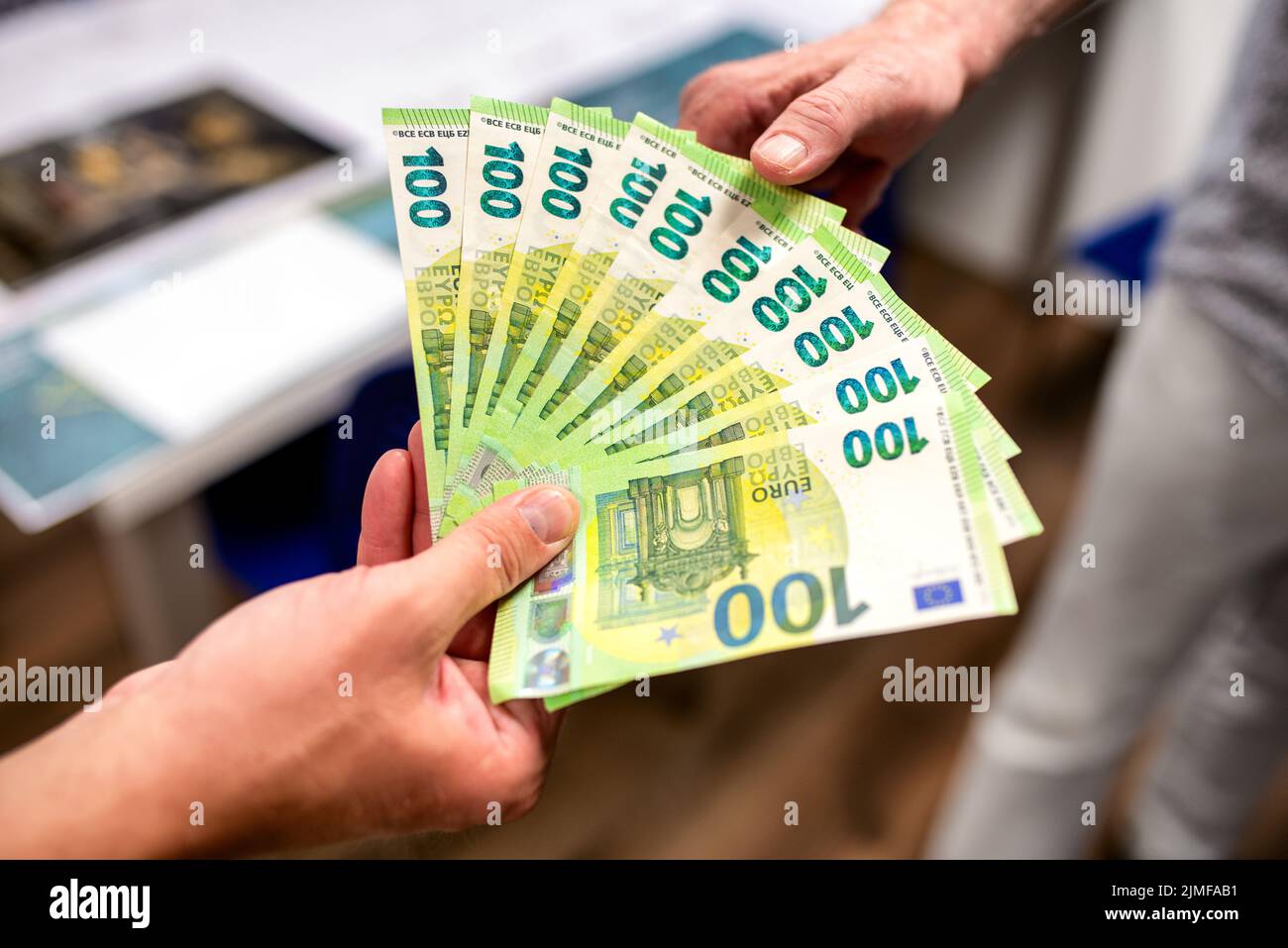 corruption concept. Giving a bribe. Money in hand. Stock Photo