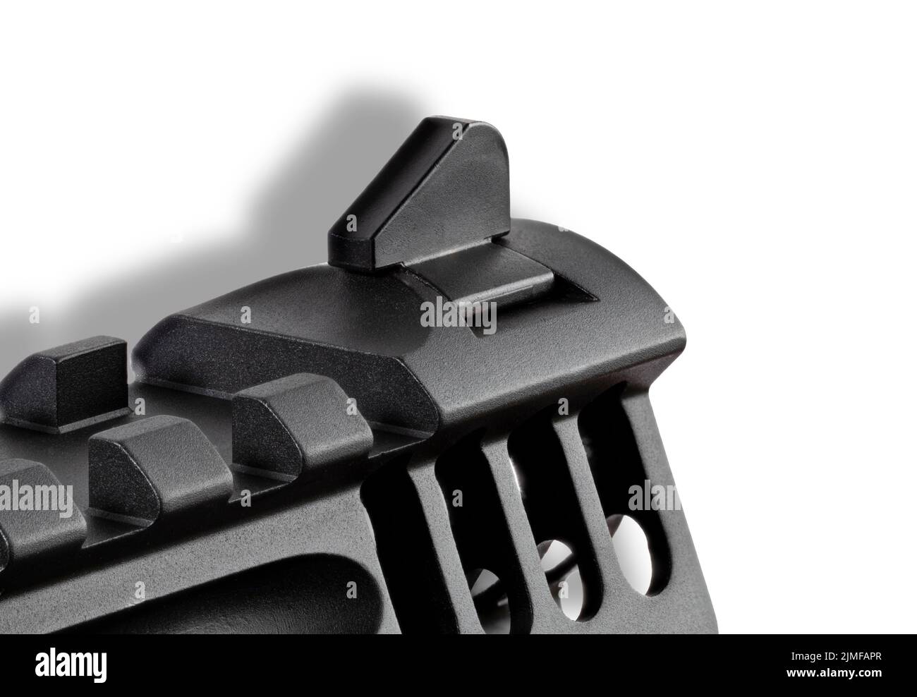 Close up view of the front sight and ports on a high-powered semi automatic handgun on white Stock Photo