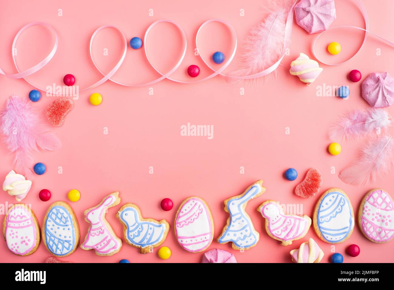 Homemade Easter cookies on pink background flat top view Stock Photo