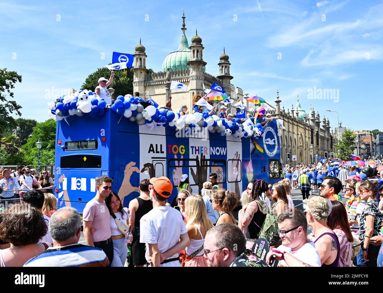 Brighton UK 6th August 2022 - The Brighton and Hove Albion bus takes part in the  Brighton and Hove Pride Parade on a beautiful hot sunny day. With good weather forecast large crowds are expected to attend the UK's biggest LGBTQ Pride festival in Brighton over the weekend : Credit Simon Dack / Alamy Live News Stock Photo