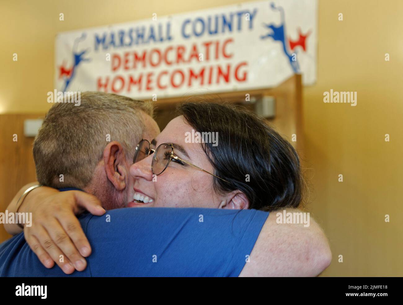 Calvert City, KY, USA. 05 Aug 2022. Marshall County Democratic Party Executive Committee Secretary Eryn Pritchett (right) hugs an unidentified attendee before the start of the 25th Mike Miller Memorial Marshall County Bean Dinner at Kentucky Dam Village State Resort Park. Pritchett said 167 guests preregistered for the event and she expected approximately 200 people to attend. (Credit: Billy Suratt/Apex MediaWire via Alamy Live News) Stock Photo