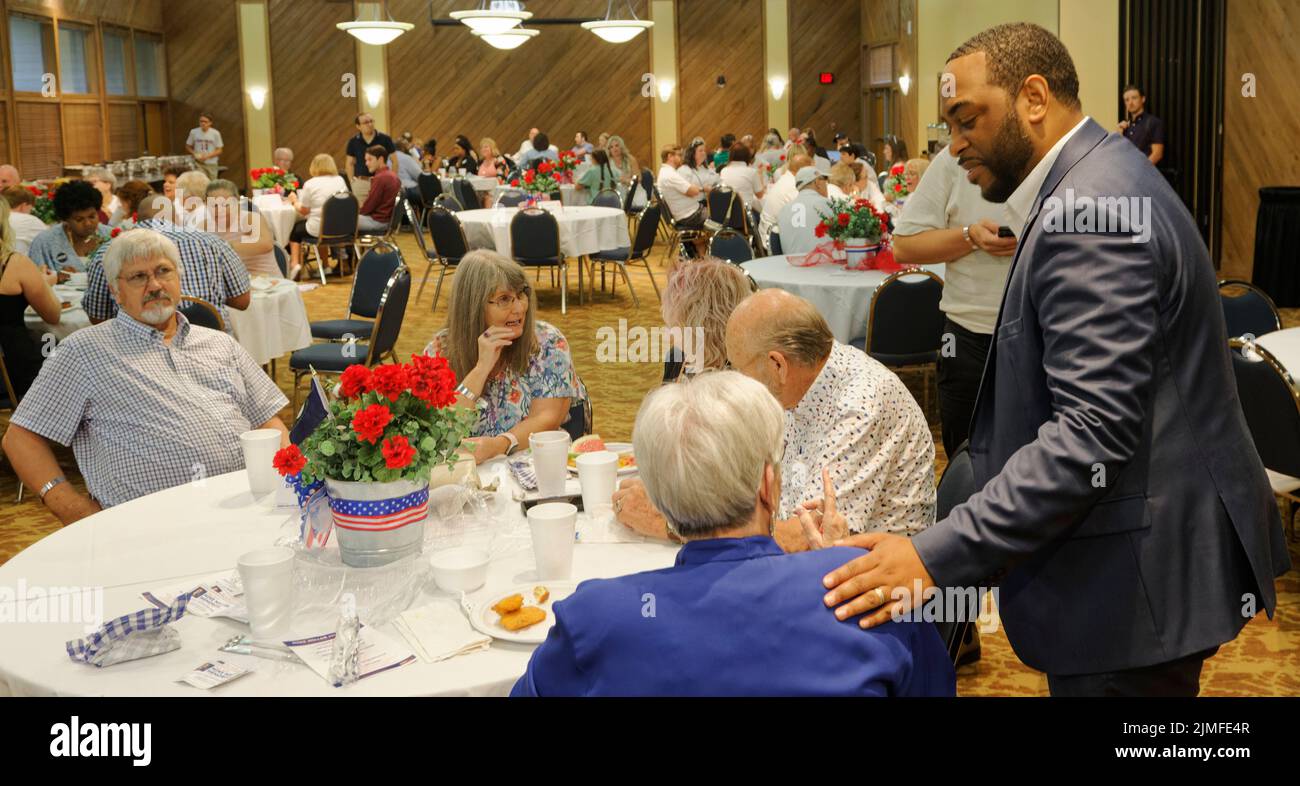 Calvert City, KY, USA. 05 Aug 2022. Kentucky Democratic nominee Charles Booker (right) campaigns for the United States Senate during the 25th Mike Miller Memorial Marshall County Bean Dinner at Kentucky Dam Village State Resort Park. A Louisville native and former state representative, Booker is the first Black nominee for a U.S. Senate seat in Kentucky history. (Credit: Billy Suratt/Apex MediaWire via Alamy Live News) Stock Photo