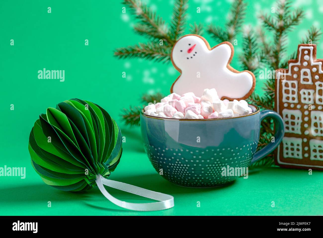 Traditional hot chocolate with marshmallows and gingerbread man. Stock Photo