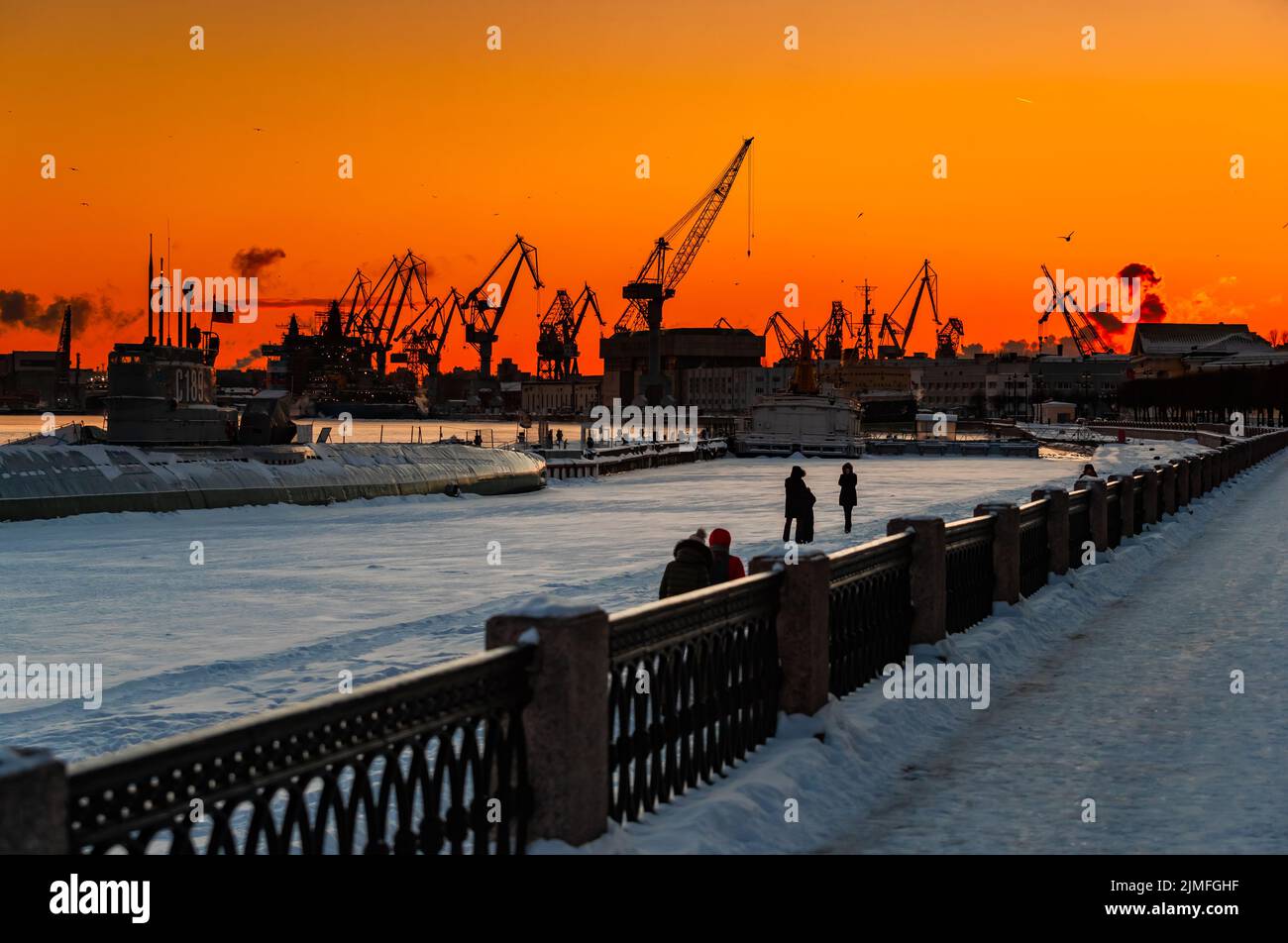 The construction of nuclear icebreakers at magic sunset, cranes of of