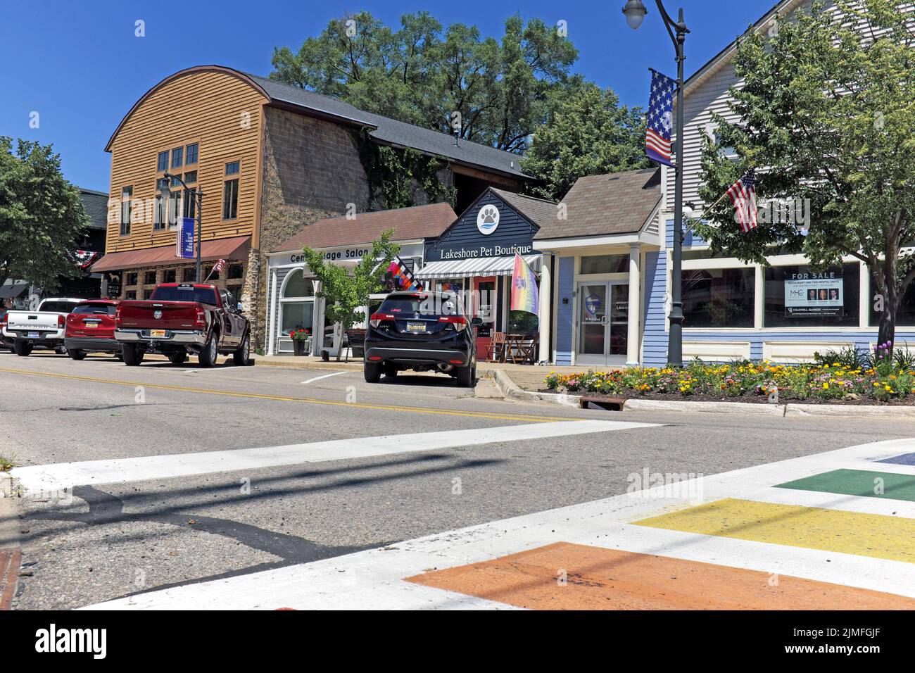 Small businesses line Center Street in the LGBTQ-friendly summer resort town of Douglas, Michigan, USA. Stock Photo