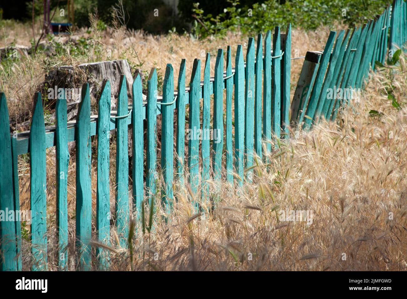 Turquoise wooden garden fence hi-res stock photography and images - Alamy