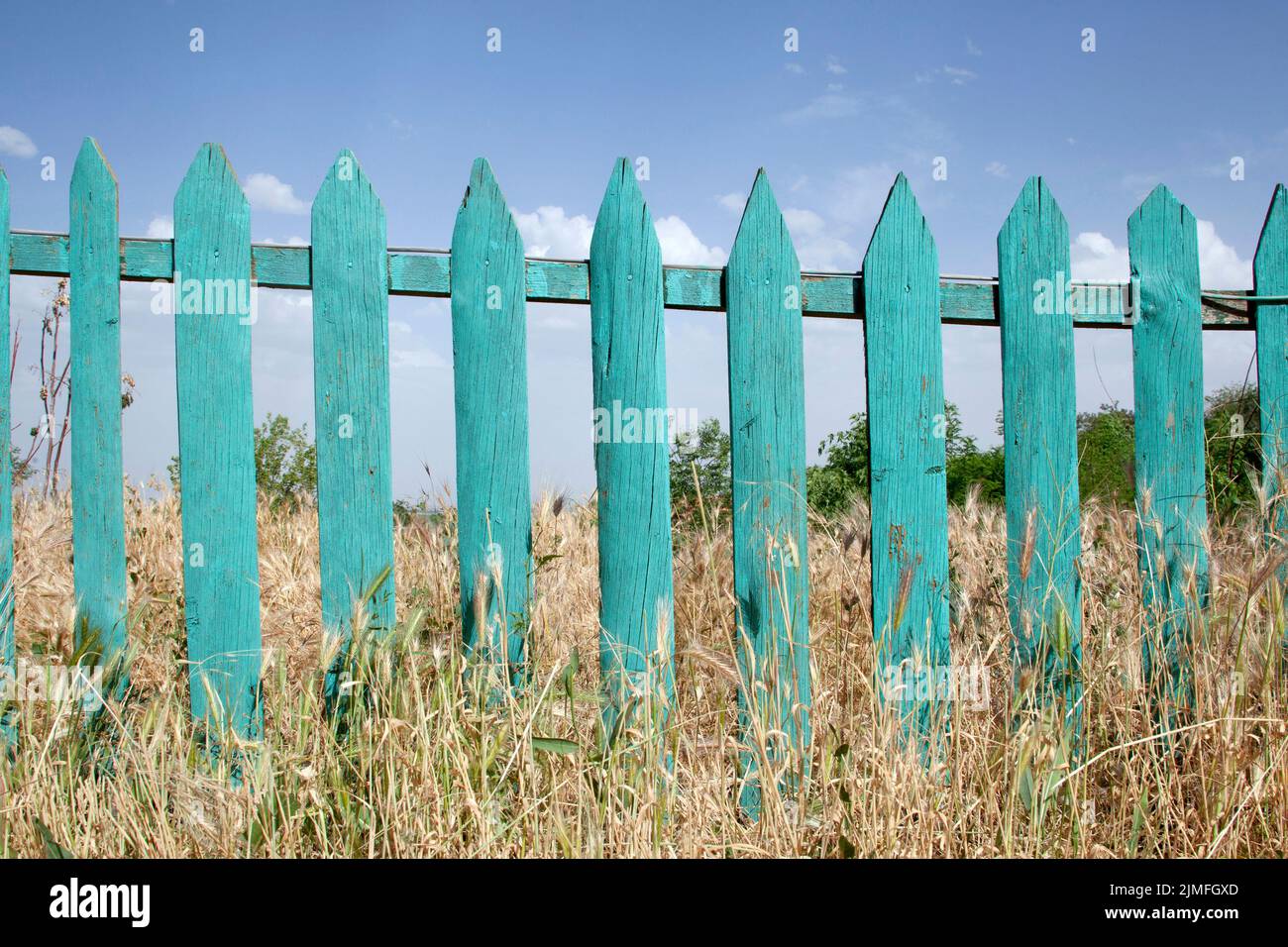 Turquoise wooden garden fence hi-res stock photography and images - Alamy