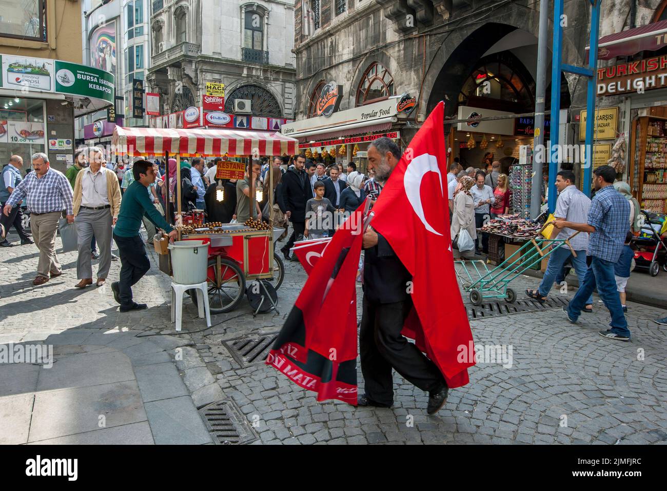 A busy street scene outside the entrance to the Spice Bazaar in the Eminonu district of Istanbul in Turkey. Stock Photo