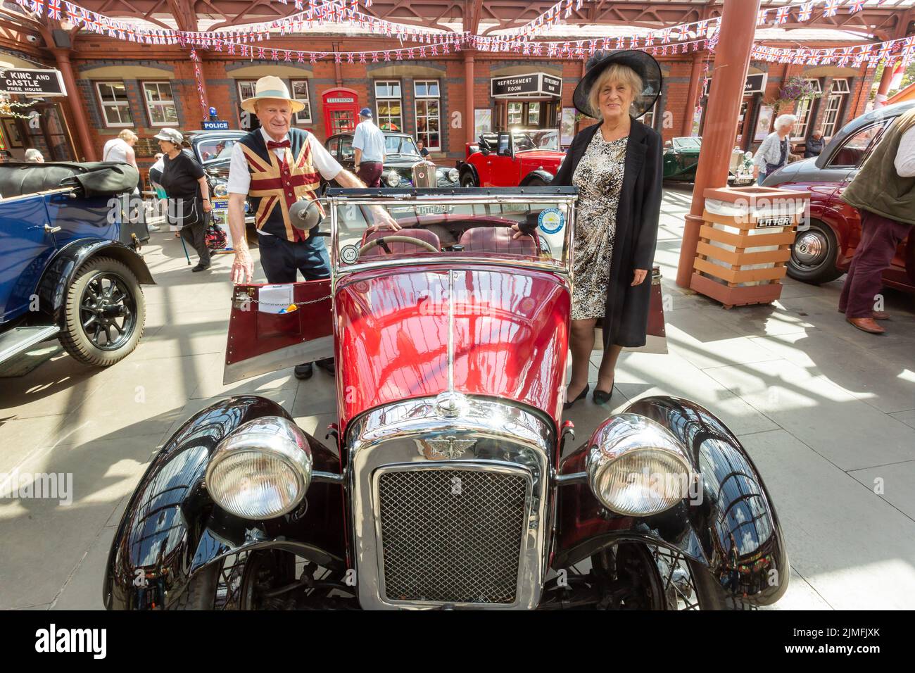 Kidderminster, Worcs, UK. 6th Aug, 2022. Jim Tangye Parker, 78, with his partner Margaret Gould, with their pride and joy - a rare aluminium bodied 1933 Austin Seven EB65 Nippy, at the Severn Valley Railway's Vintage Transport Extravaganza. The annual event has steam engines as well as vintage motor vehicles. Credit: Peter Lopeman/Alamy Live News Stock Photo