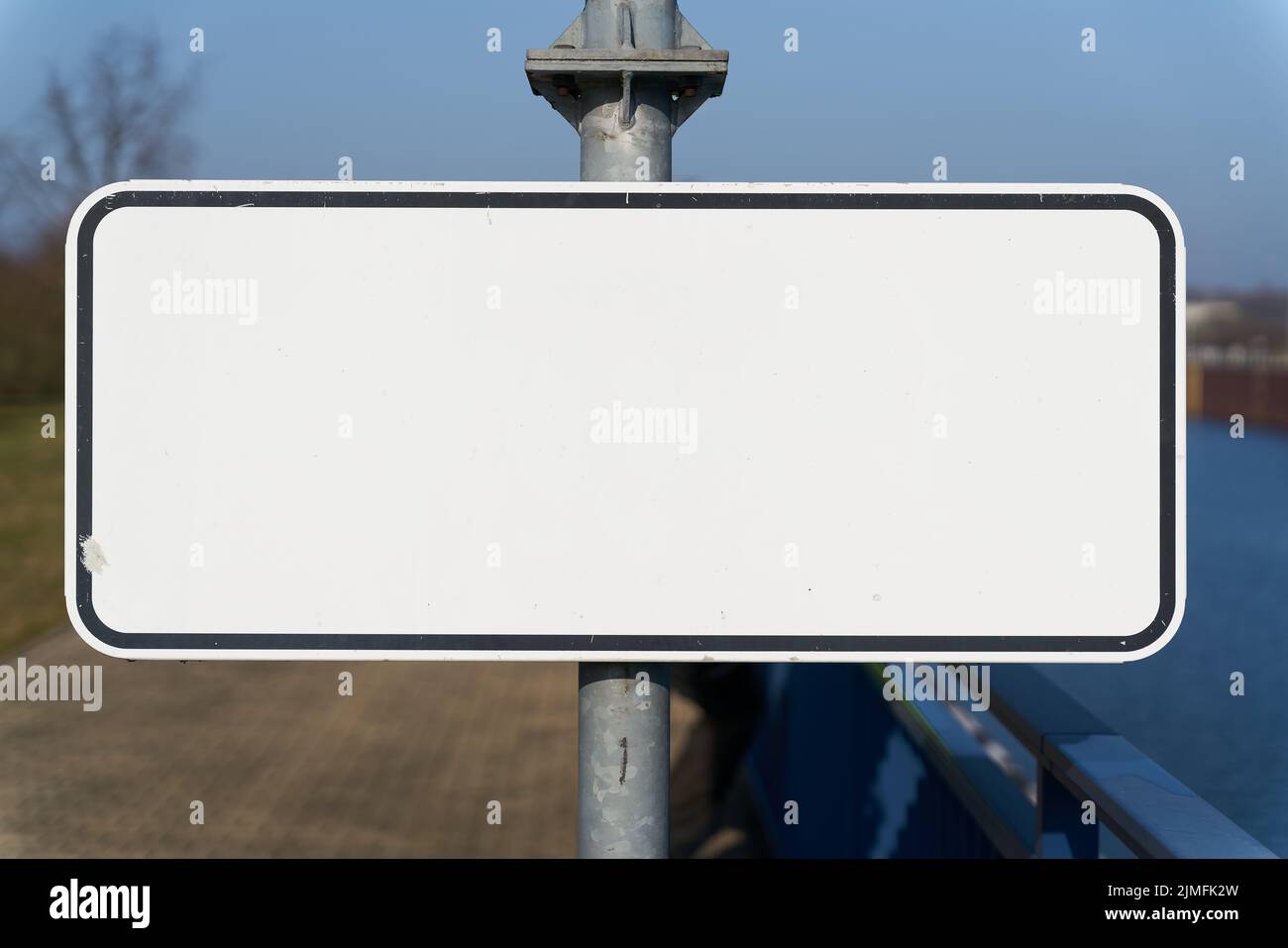 Blank white sign with text space on a pillar Stock Photo