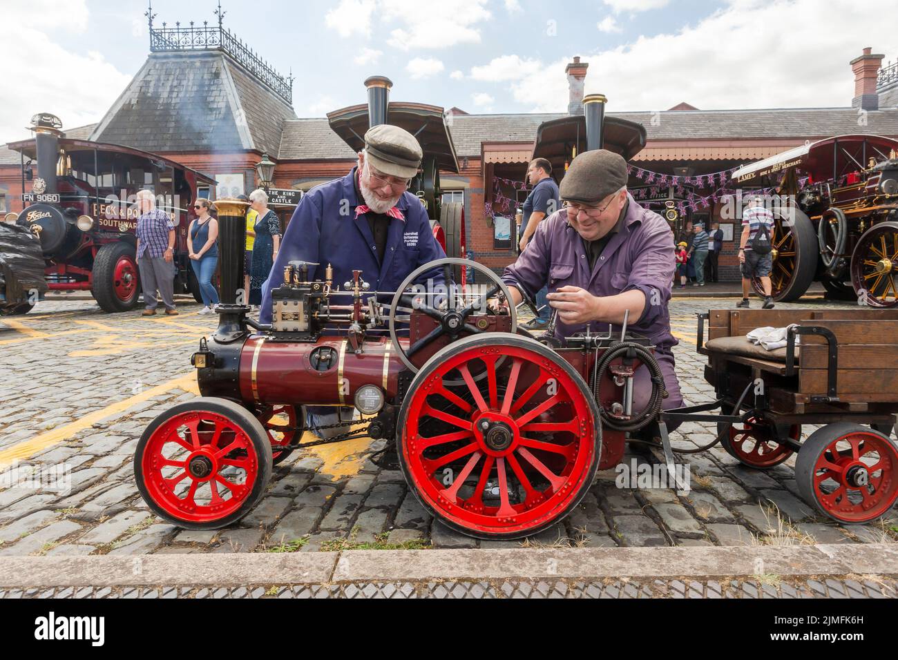 Kidderminster, Worcs, UK. 6th Aug, 2022. Father and son steam enthusiasts Les and Ian Bromley, 83 and 53, fine tune their pride and joy miniature steam traction engine, a Sidbury 1:4 scale Marshall steam traction engine at the Severn Valley Railway's Vintage Transport Extravaganza at Kidderminster, Worcestershire. They built the engine by hand taking over 2,000 hours of expert labour. The annual event has vintage motor vehicles as well as steam engines. Credit: Peter Lopeman/Alamy Live News Stock Photo